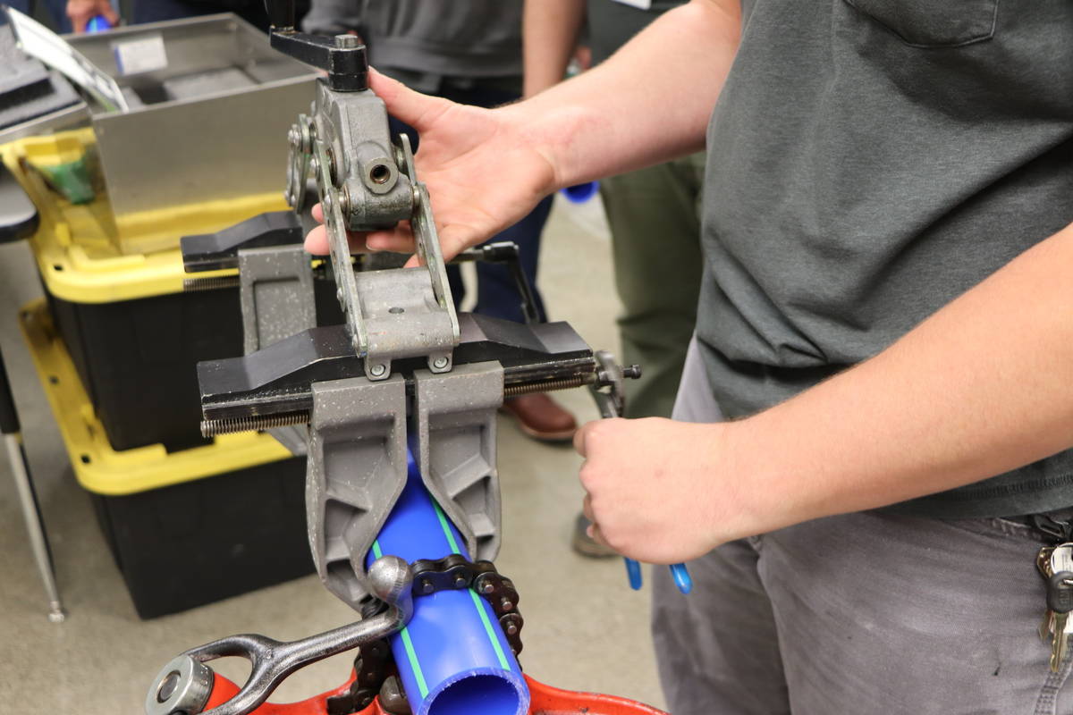 A plumbing student practices the new training he received as part of the Aquatherm certification
