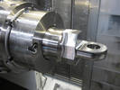 CNC mill-turn machine producing a titanium part for a Boeing 777 aircraft