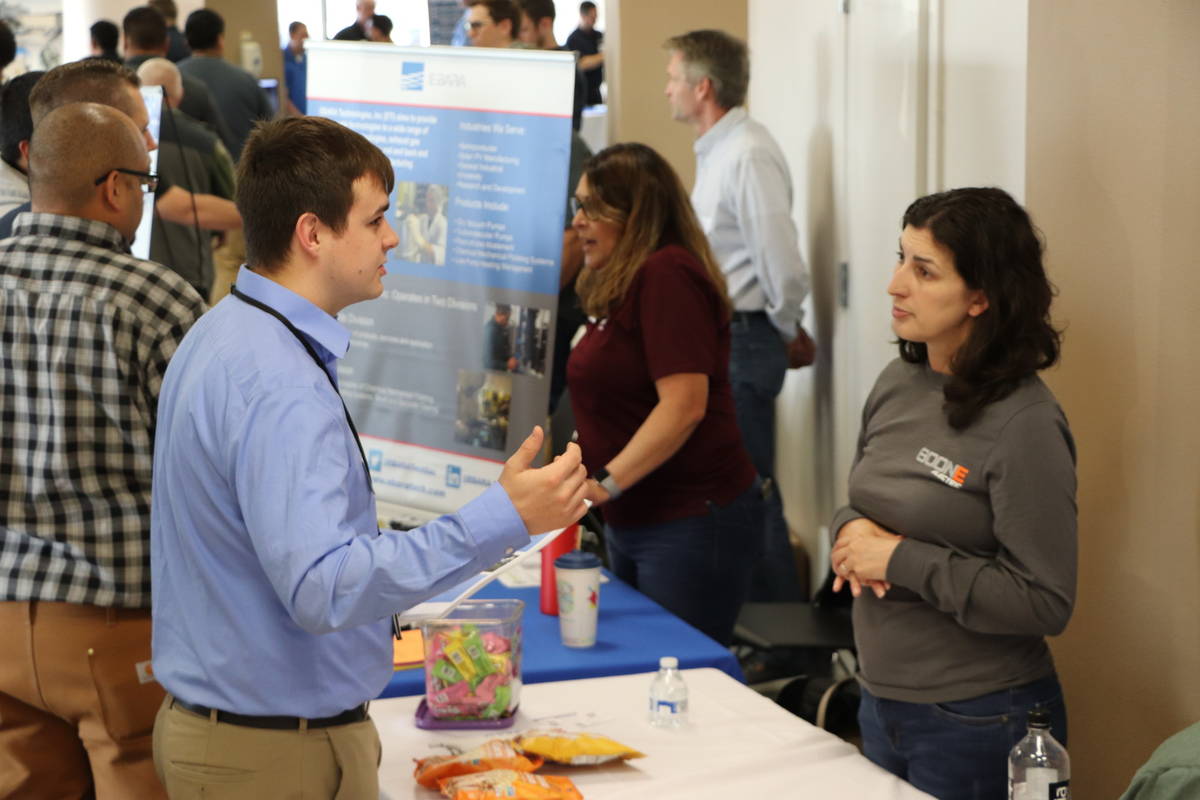 ITCS student Hunter Chace networks with an employer at  Perry Tech's 2019 Spring Employer Expo.
